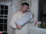 Click to see Ken opening gift 2.jpg